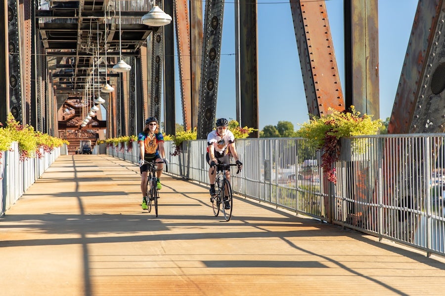 two cyclists on the clinton library bridge